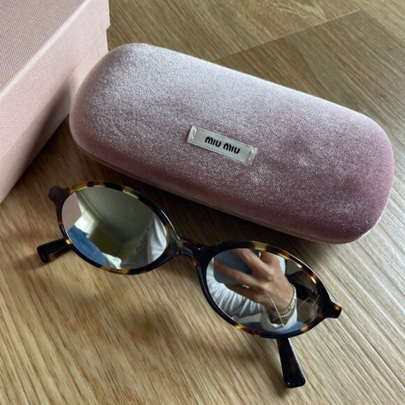Miu Miu glasses mirrored lens